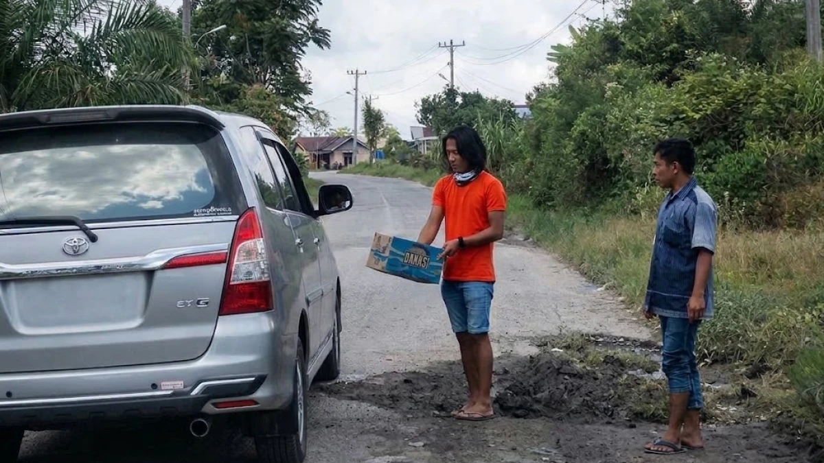 Hukum Pungli Akses Masuk Jalan Umum