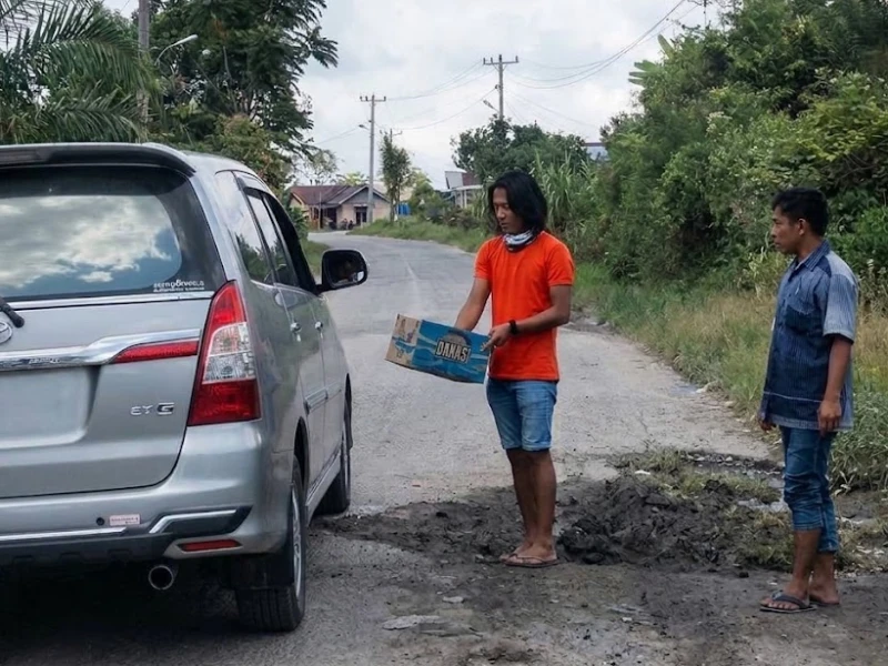Hukum Pungli Akses Masuk Jalan Umum